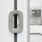 Close-up of a modern kitchen cabinet handle with a blurred background