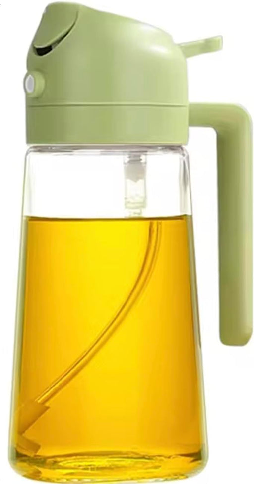 Glass oil bottle with green lid and handle filled with oil on a white background