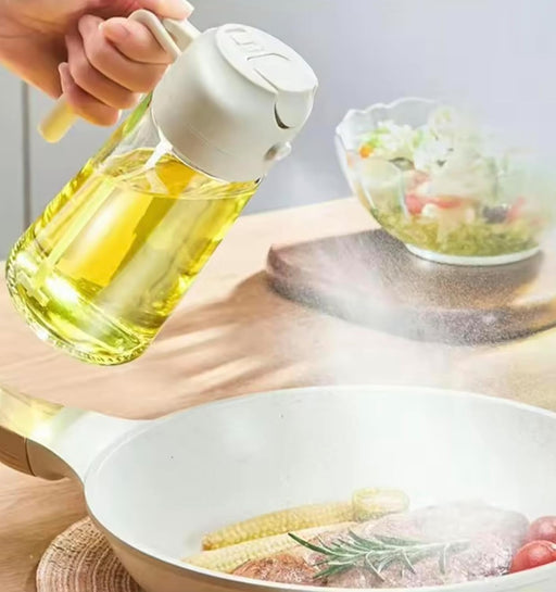 Person pouring oil from a bottle into a frying pan with a salad in the background