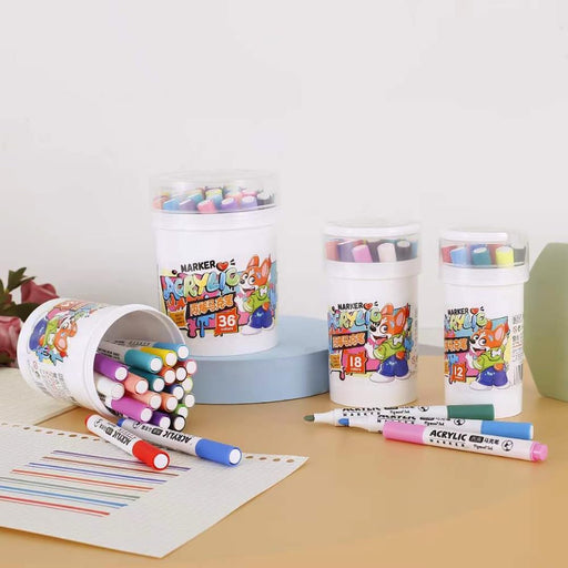 Colorful markers and marker holders on a table with a white background