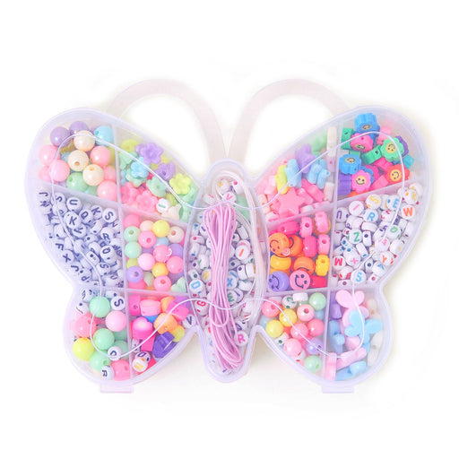 Heart-shaped container filled with colorful beads and elastic bands on a white background