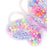 Colorful bead set with letters and numbers in a heart-shaped container on a white background