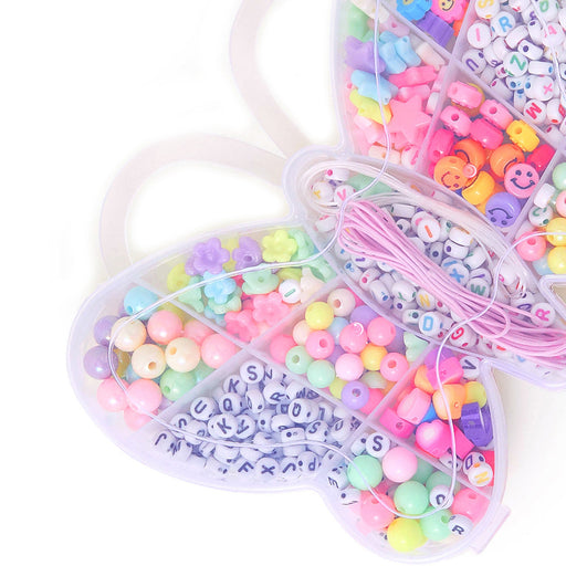 Colorful bead set with letters and numbers in a heart-shaped container on a white background
